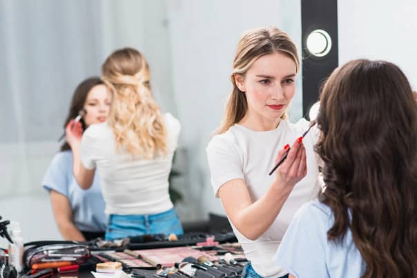 visagiste-creating-professional-makeup-woman-studio