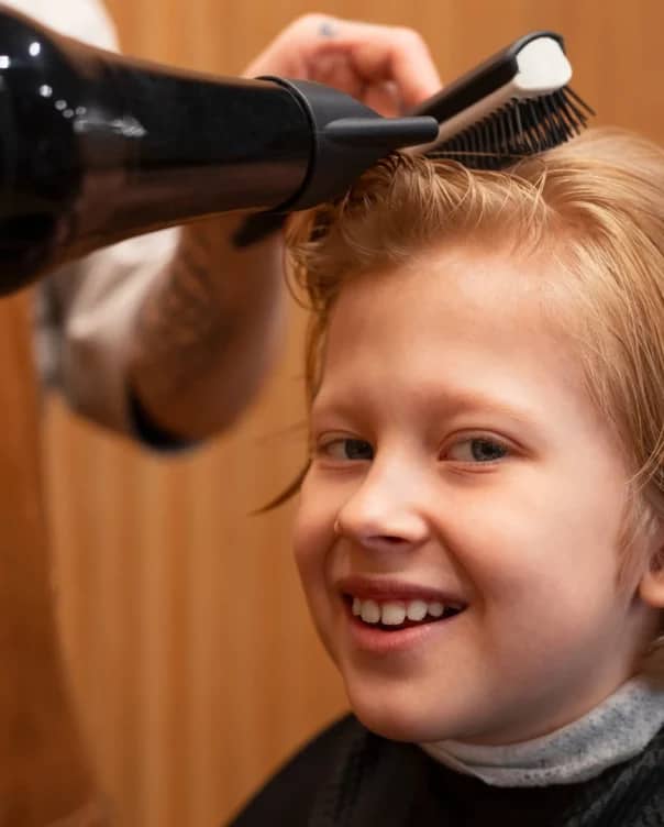 child-getting-their-hair-blown-salon